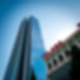 The stunning facade of Al Aneeqa Tower against a clear blue sky